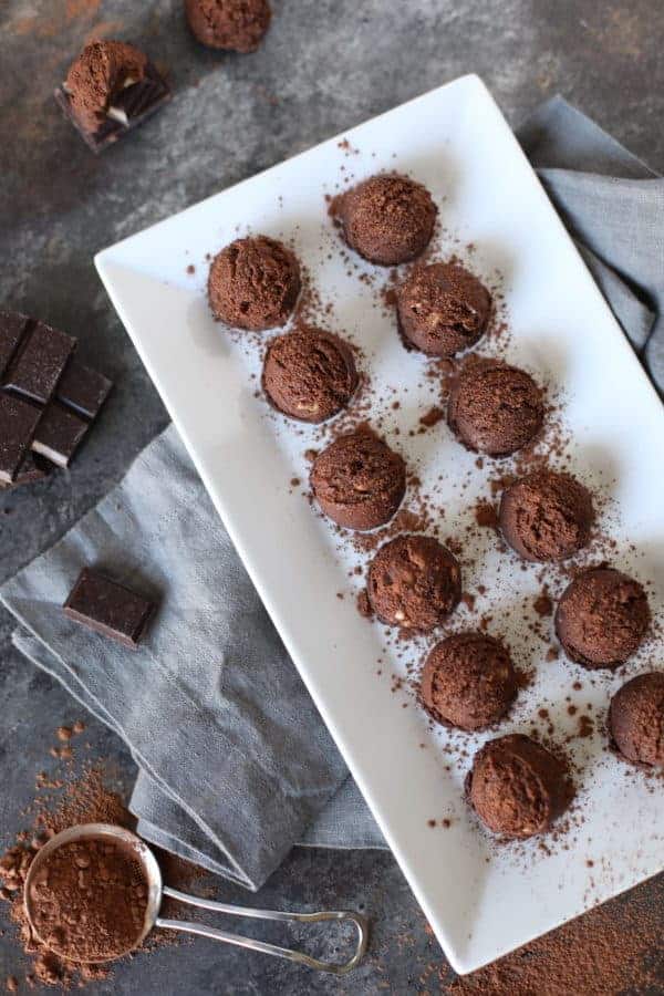 no-bake brownie bites on a white serving tray