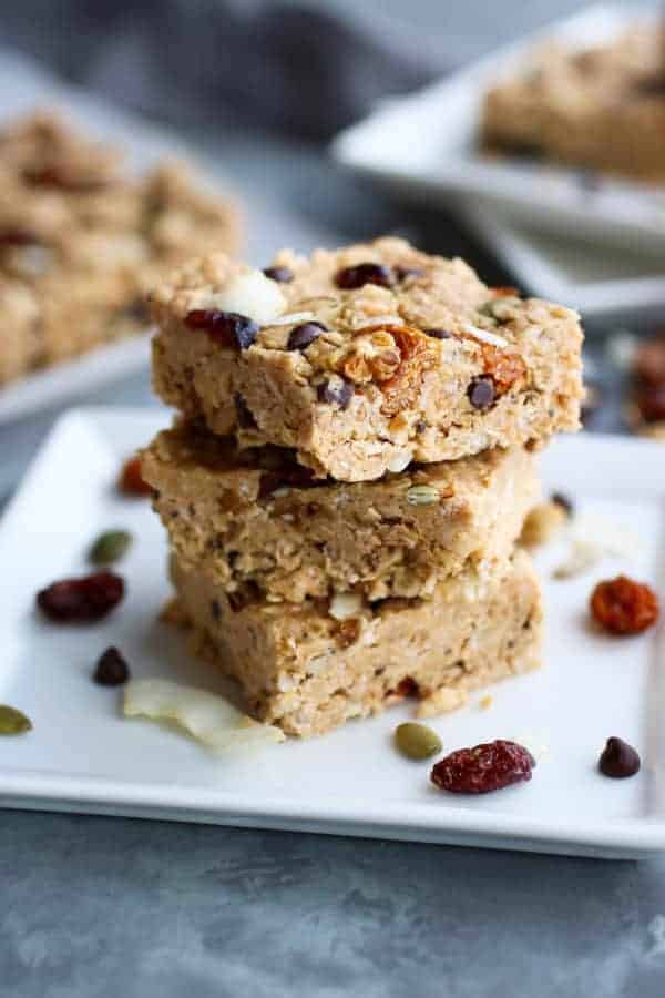 Stack of homemade granola bars on a plate.