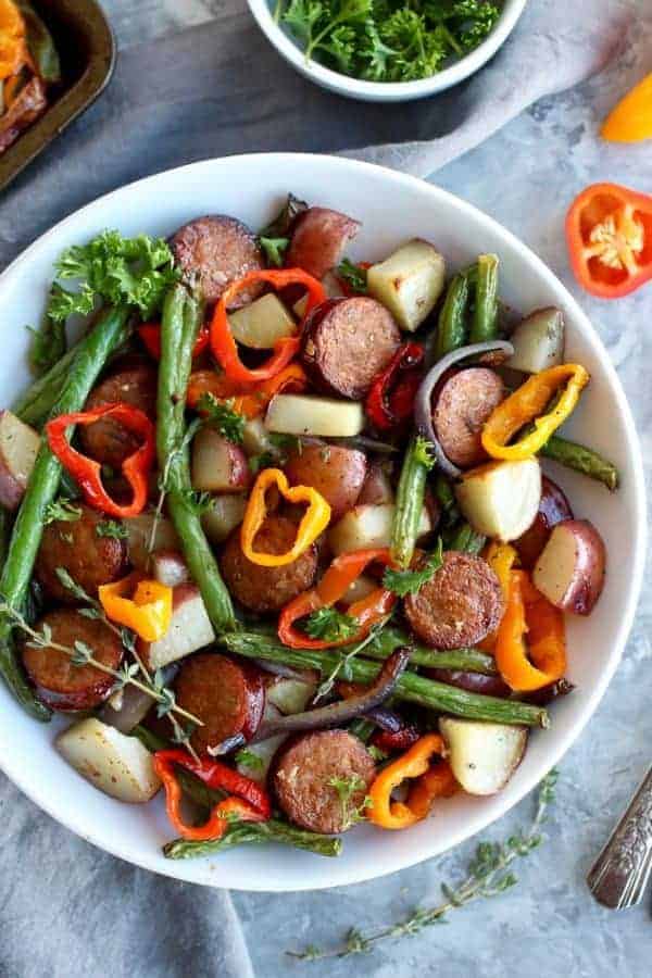 One-Pan Kielbasa Veggie Bake in a white bowl