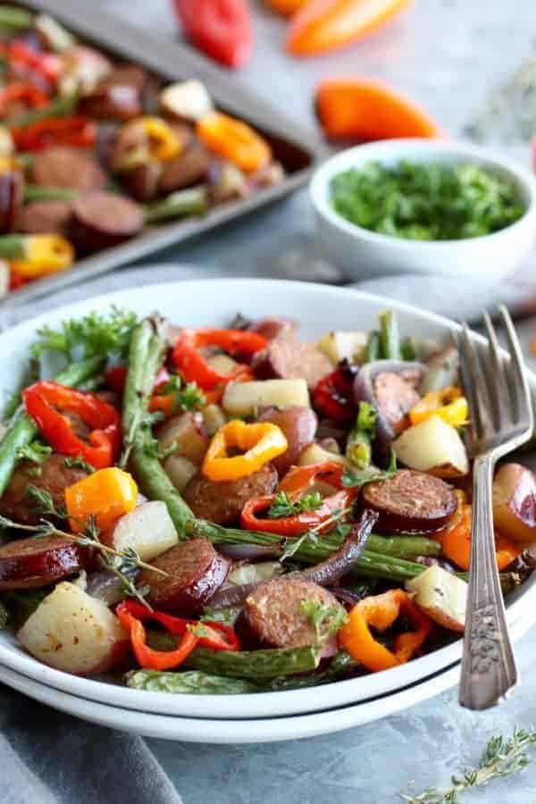 One-Pan Kielbasa Veggie Bake in a white bowl