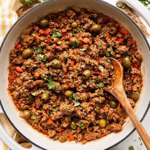 Skillet filled with Stovetop Picadillo topped with fresh cilantro.