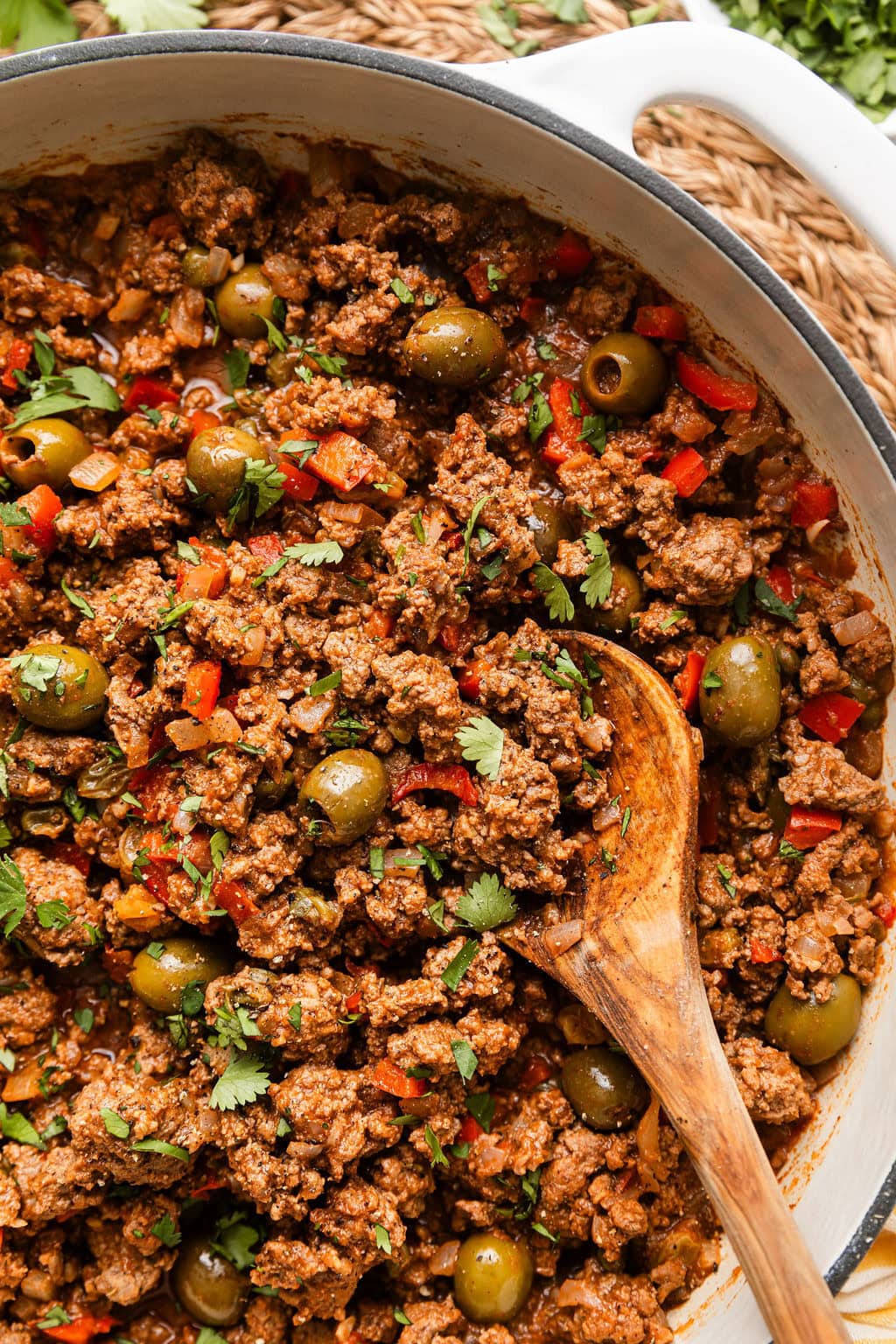 Close up view of a skillet of Stovetop Picadillo topped with fresh cilantro. 