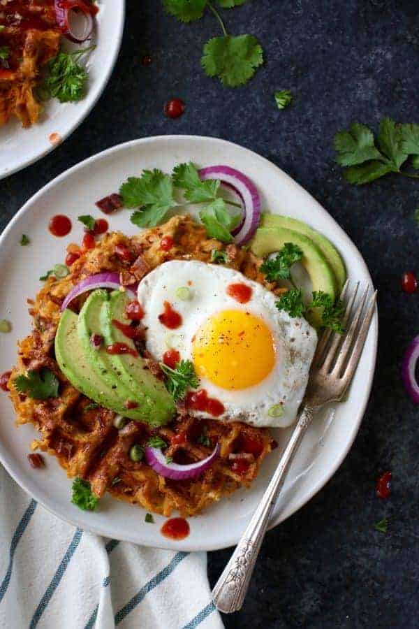 Savory Sweet Potato Bacon Waffles on a white plate