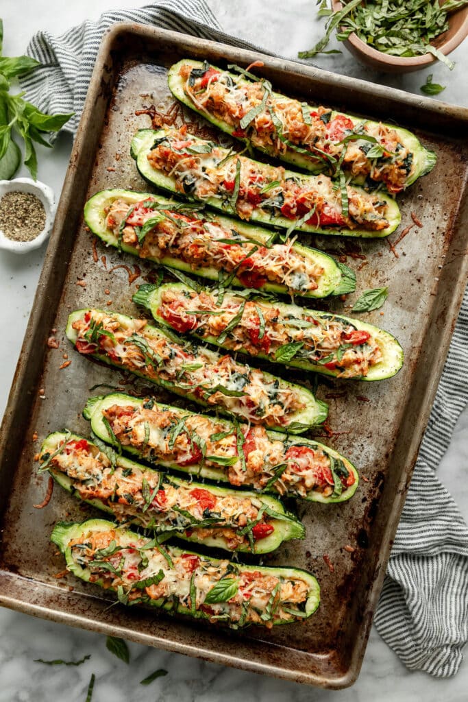 Overhead view of a pan of freshly baked Delicious Italian-Sausage Stuffed Zucchini Boats.