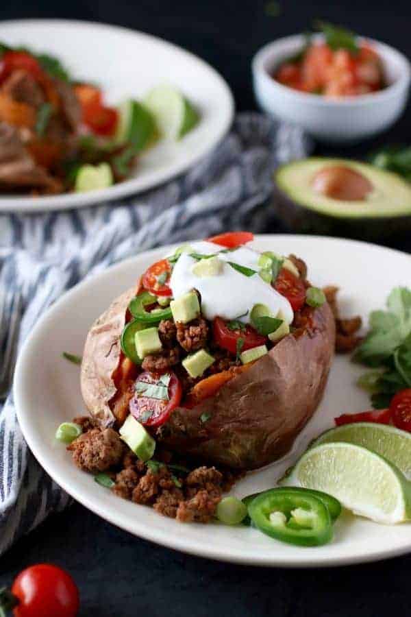 Taco-Stuffed Sweet Potatoes on a white plate