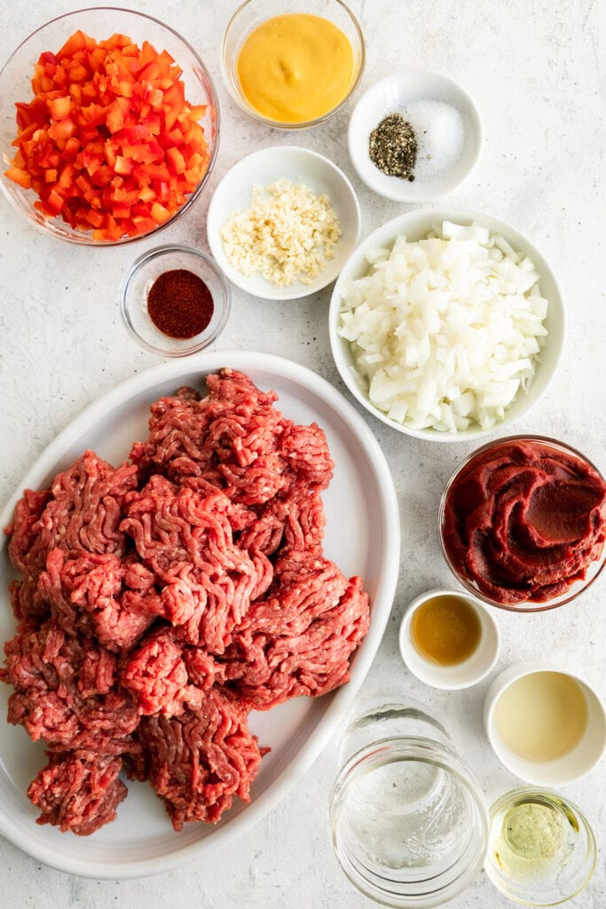 All ingredients for healthy sloppy joes arranged together in small bowls and platter.