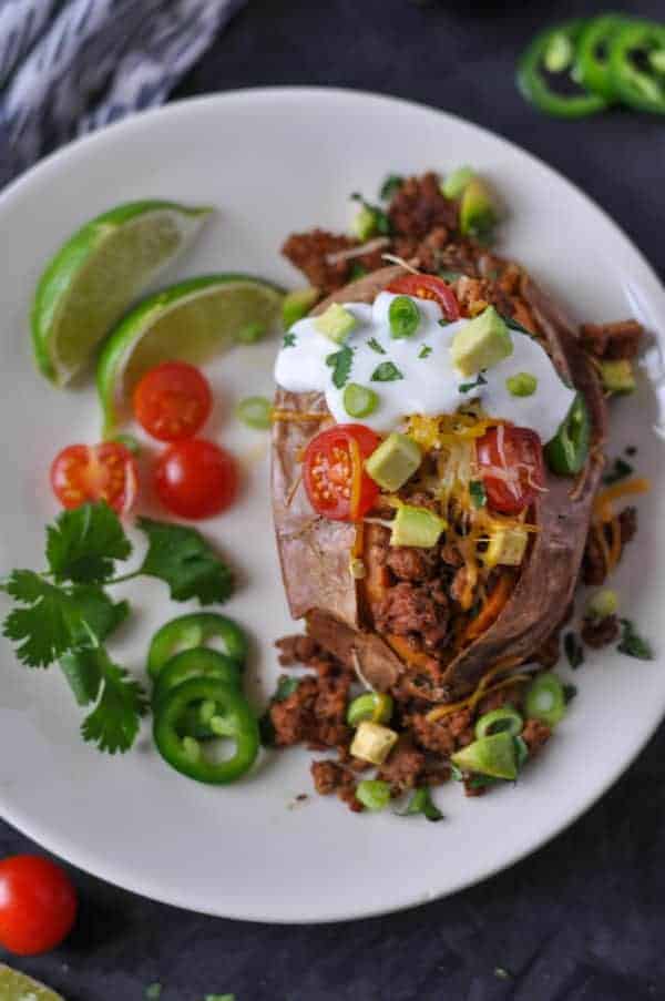 Taco-Stuffed Sweet Potatoes on a white plate