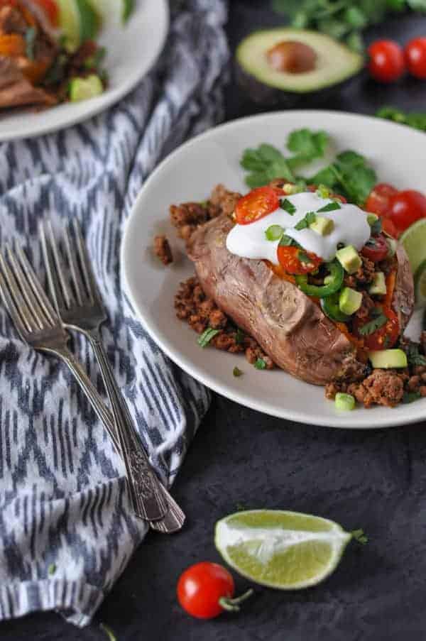 Taco-Stuffed Sweet Potatoes on a white plate