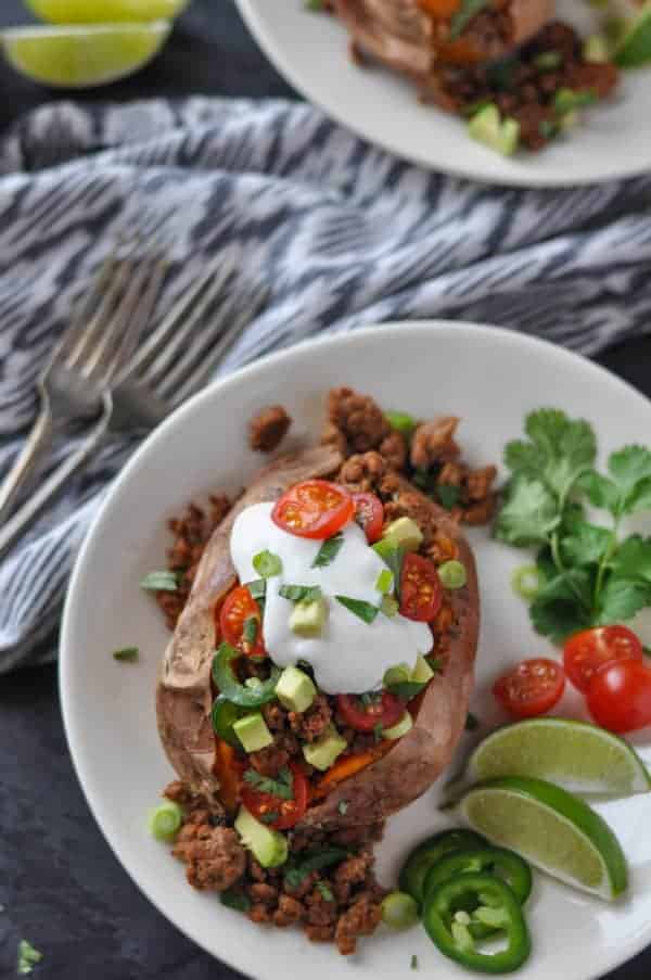 Taco-Stuffed Sweet Potatoes on a white plate