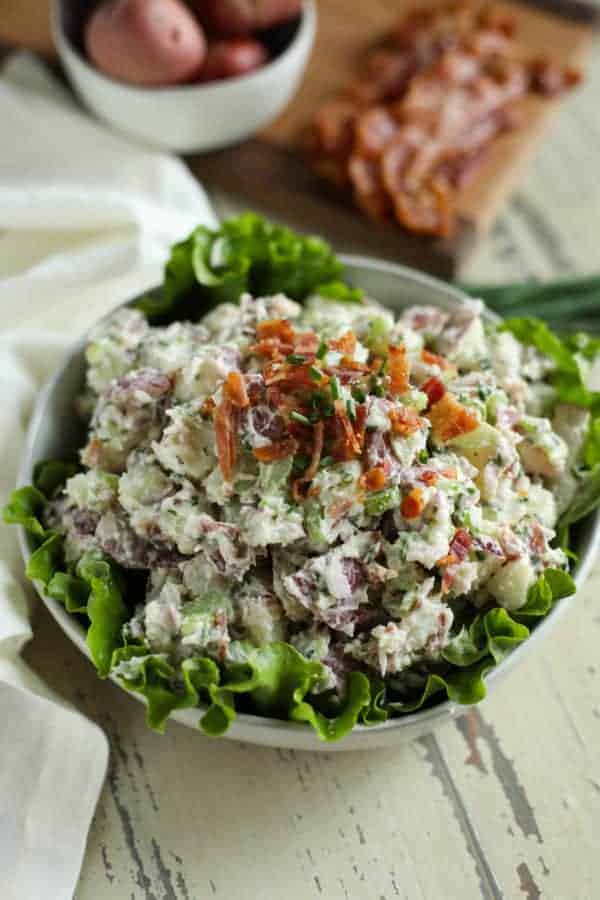 aerial view of Bacon Chive Potato Salad in a white bowl