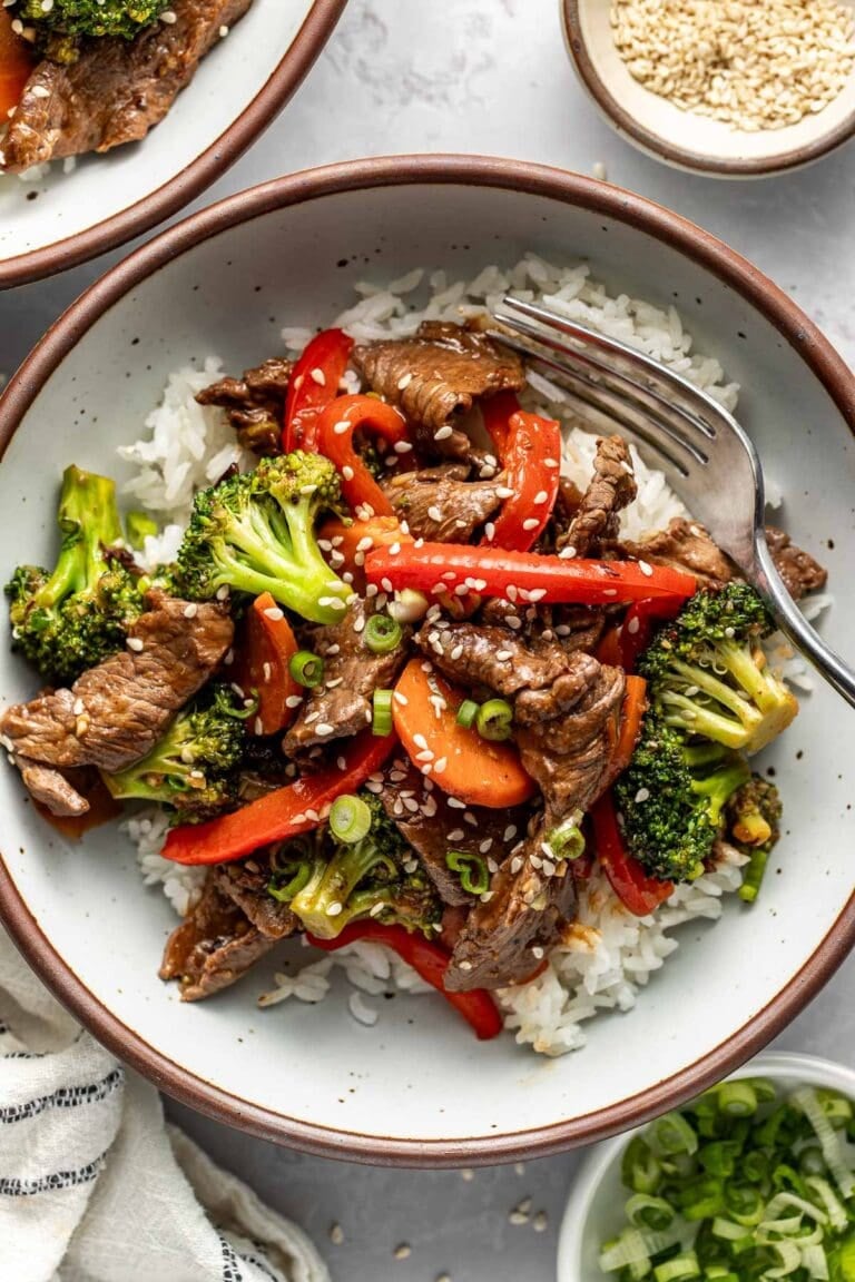 Overhead view of a plate filled with Steak Stir Fry over white rice.