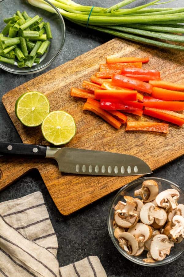 ingredients for the Whole30 Steak Stir-Fry on a cutting board