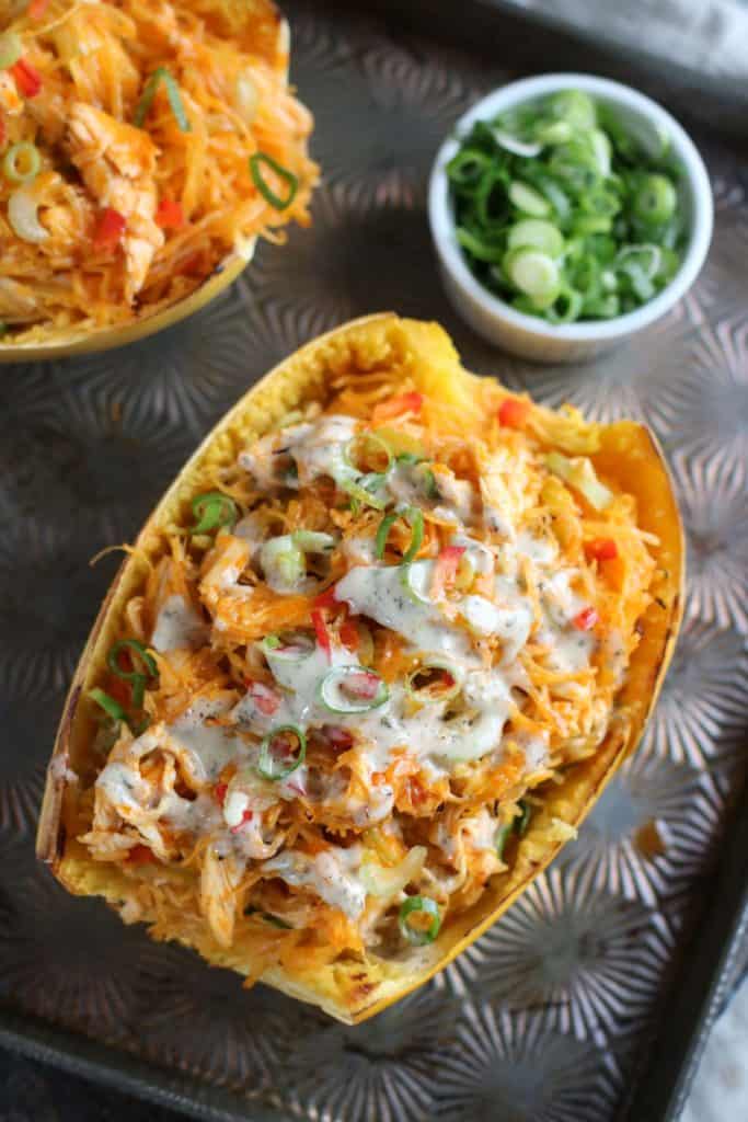 Buffalo Chicken Stuffed Spaghetti Squash on a baking sheet