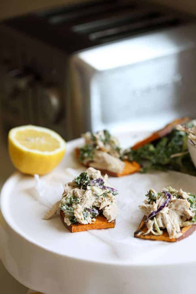 Caesar Chicken Salad on Sweet Potato Toast on a white plate