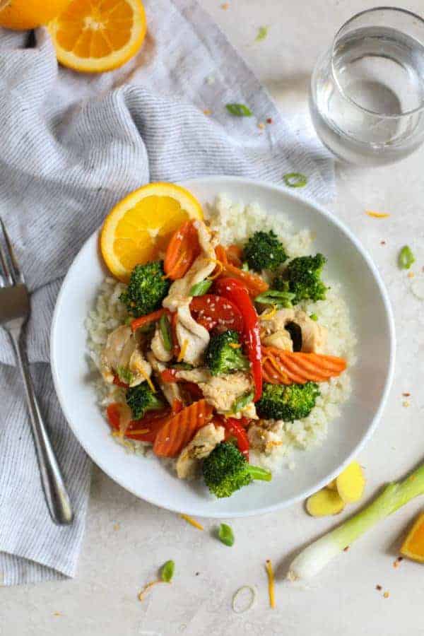 Overhead view of Orange-Ginger Chicken Stir Fry on a white plate