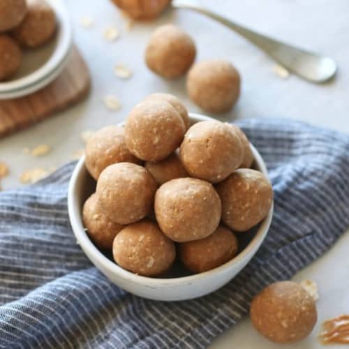 3-Ingredient Peanut Butter Bites stacked up in a white bowl