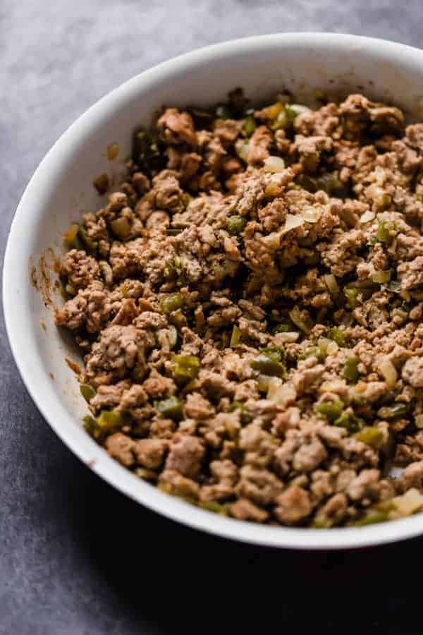 cooked ground turkey in a white bowl 