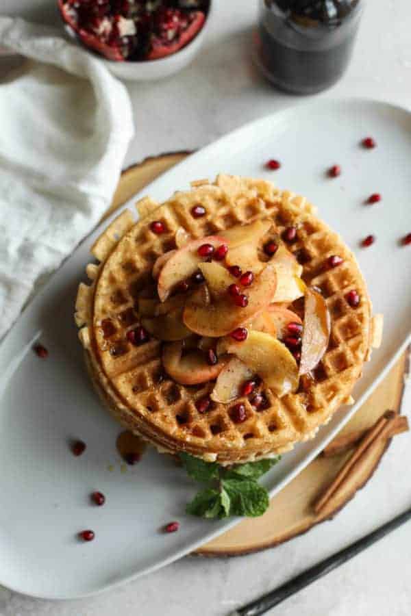 Overhead view of waffles on a white plate