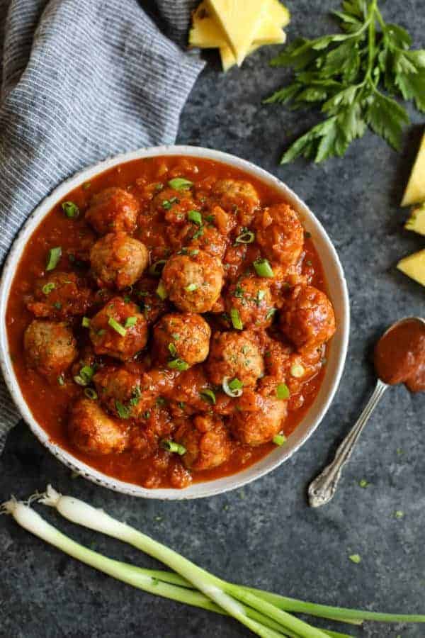 Overhead view of Pineapple BBQ Chicken Meatballs in a white bowl