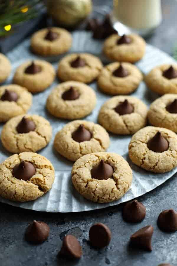 Gluten-free peanut butter blossoms on a silver tray. 