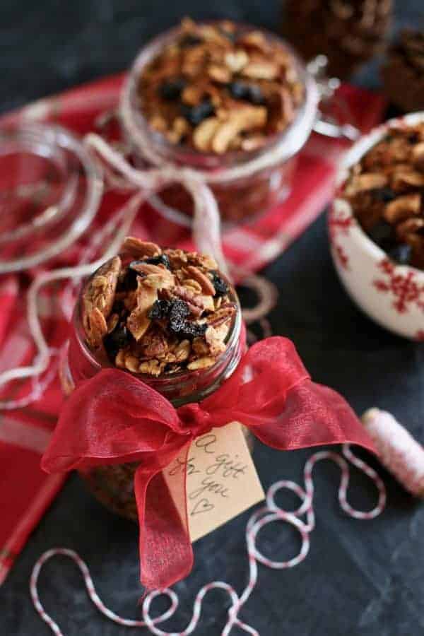 Vanilla Chai Spiced Granola in a mason jar wrapped with a red ribbon and a tag on it that says "gift for you". 