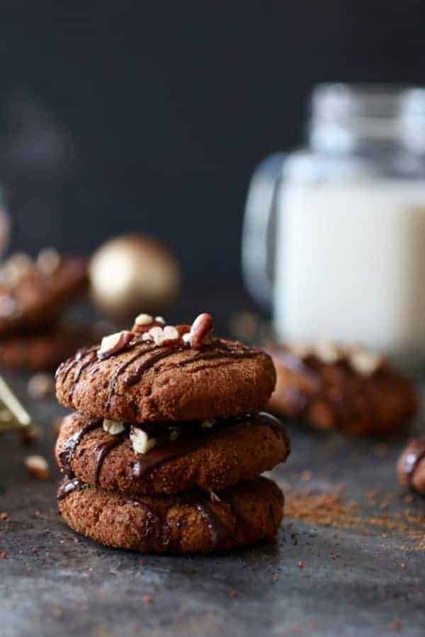 Paleo Soft Batch Ginger Molasses Cookies stacked into a column of three cookies