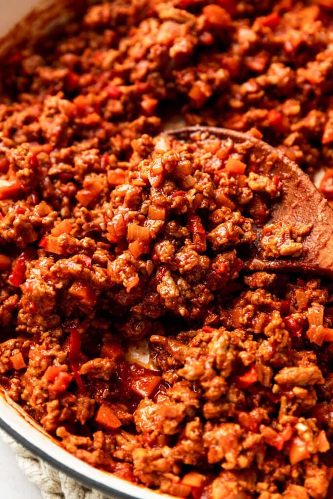 Ground Turkey Sloppy Joes being stirred together in a pan. 