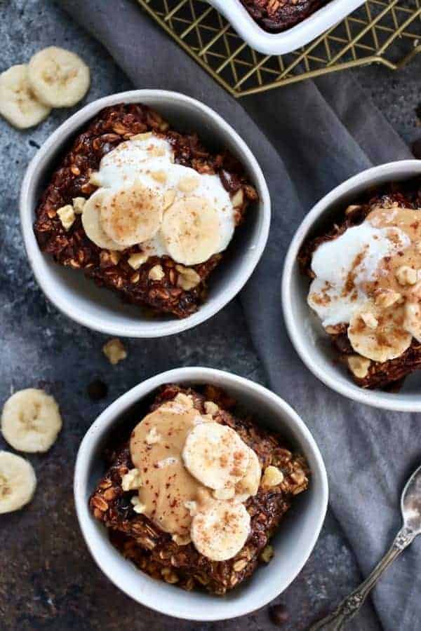 overhead photo of 3 small white bowls holding a serving of Banana Chocolate Chip Baked Oatmeal