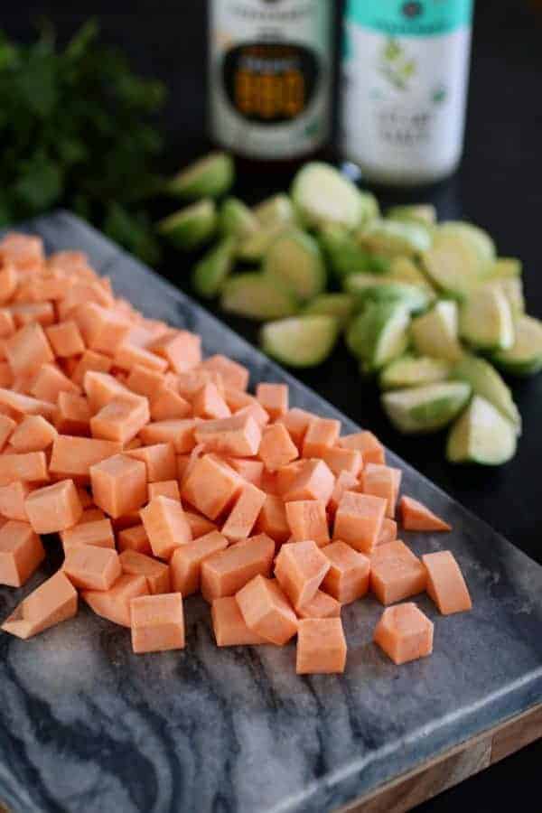 Photo of cubed sweet potatoes and quartered Brussels Sprouts for the BBQ Ranch Turkey Veggies Skillet.