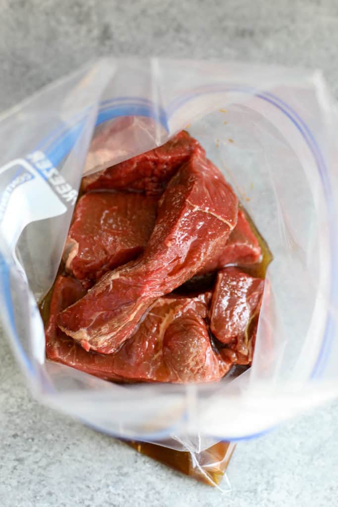process shot of steak marinading