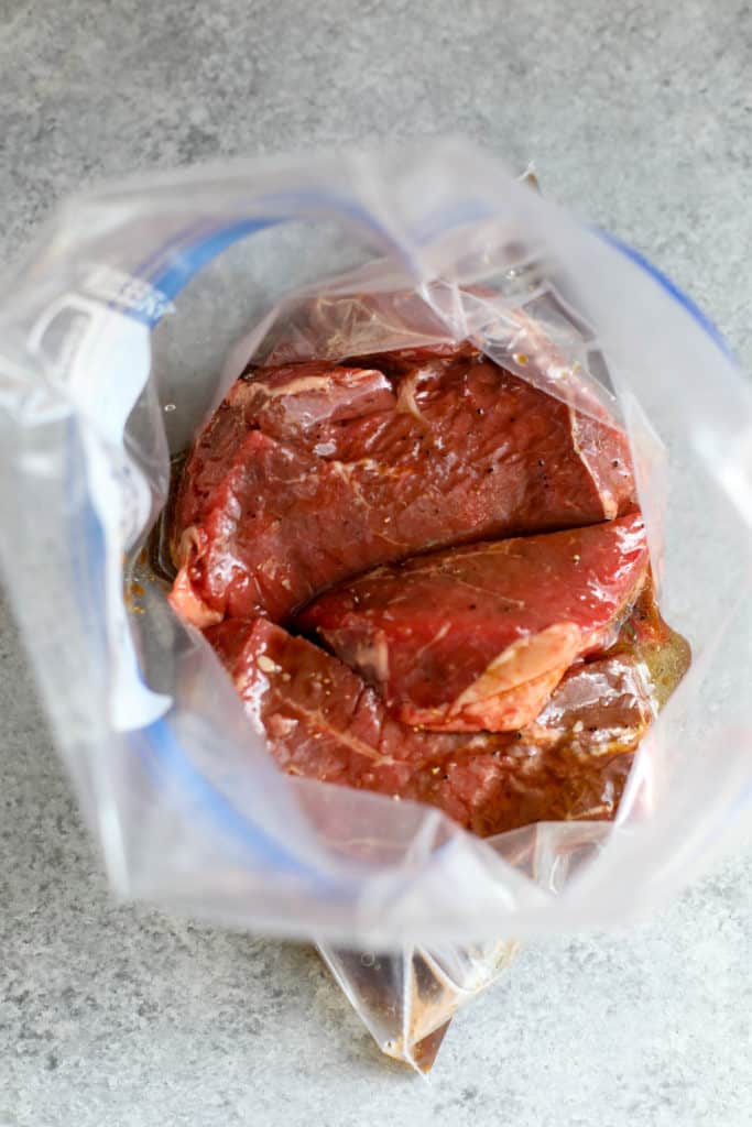 process shot of steak marinading