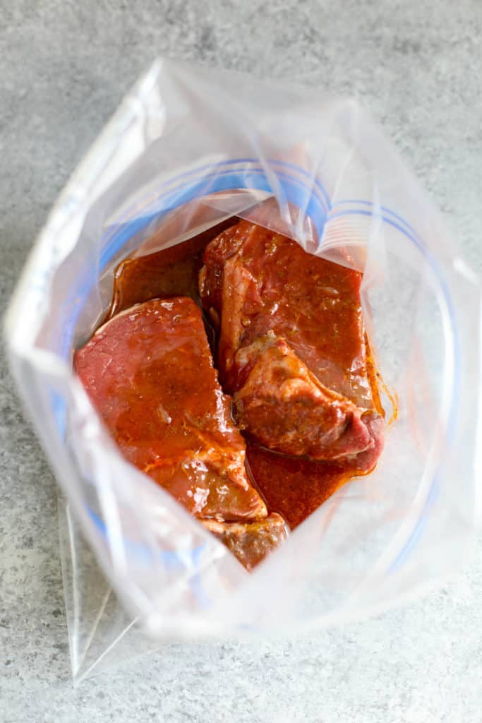 process shot of steak marinading