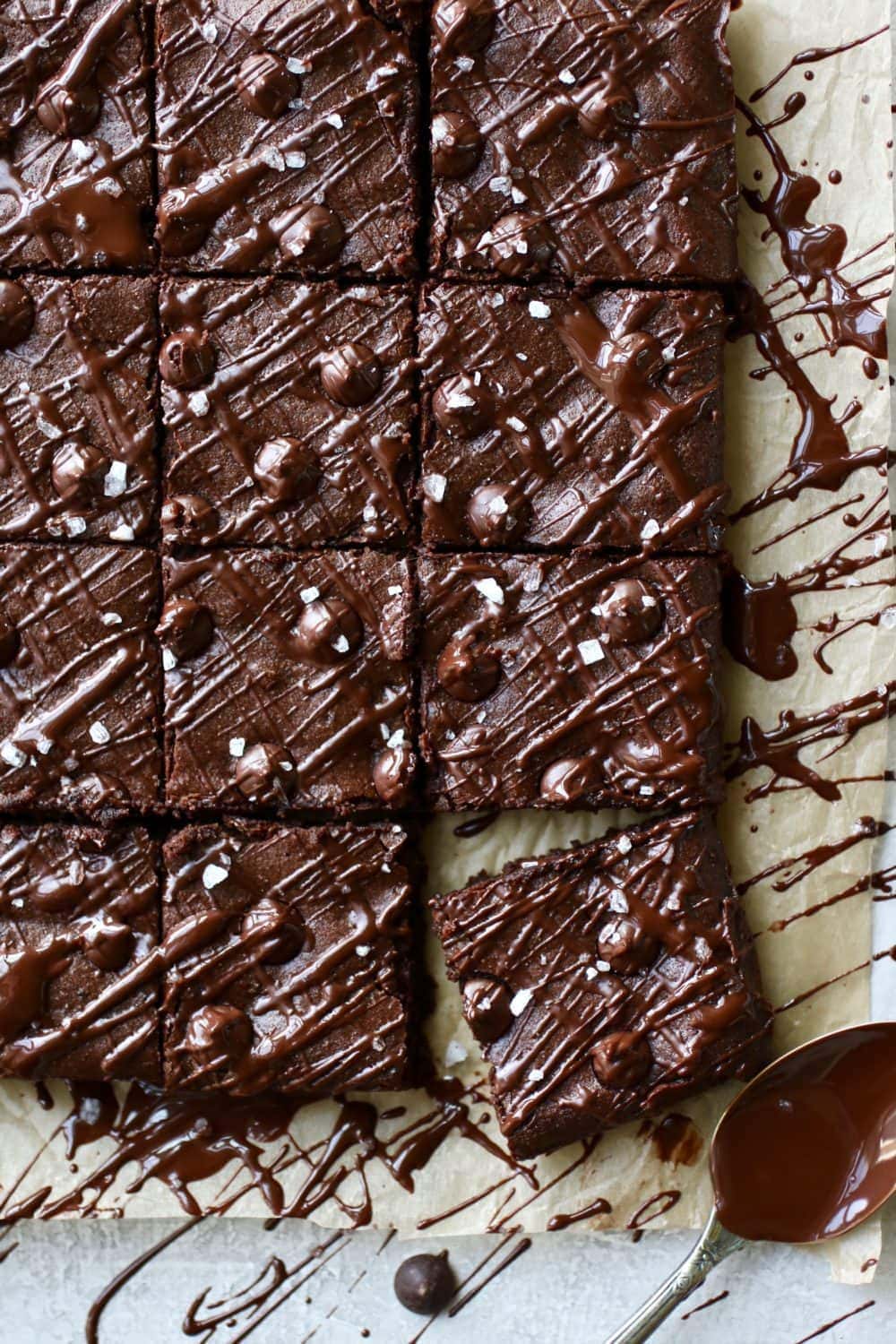 Overhead shots of Paleo Fudgy Brownies cut into 16 squares and drizzled with chocolate. 