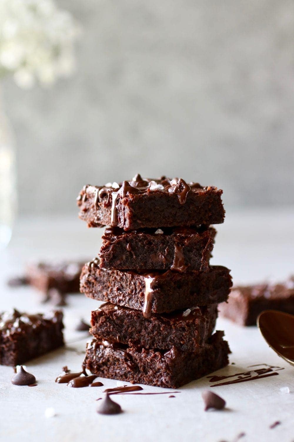 Photo of a stack of five Paleo Fudgy Brownies. 