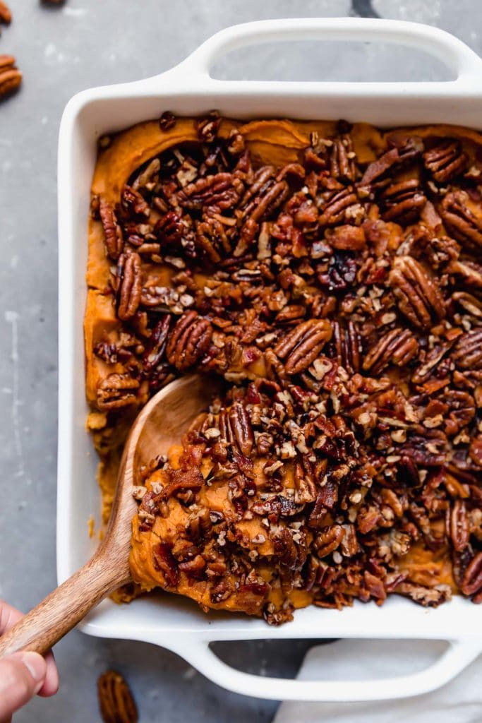 Healthy Sweet Potato Casserole topped with pecans for a Thanksgiving menu