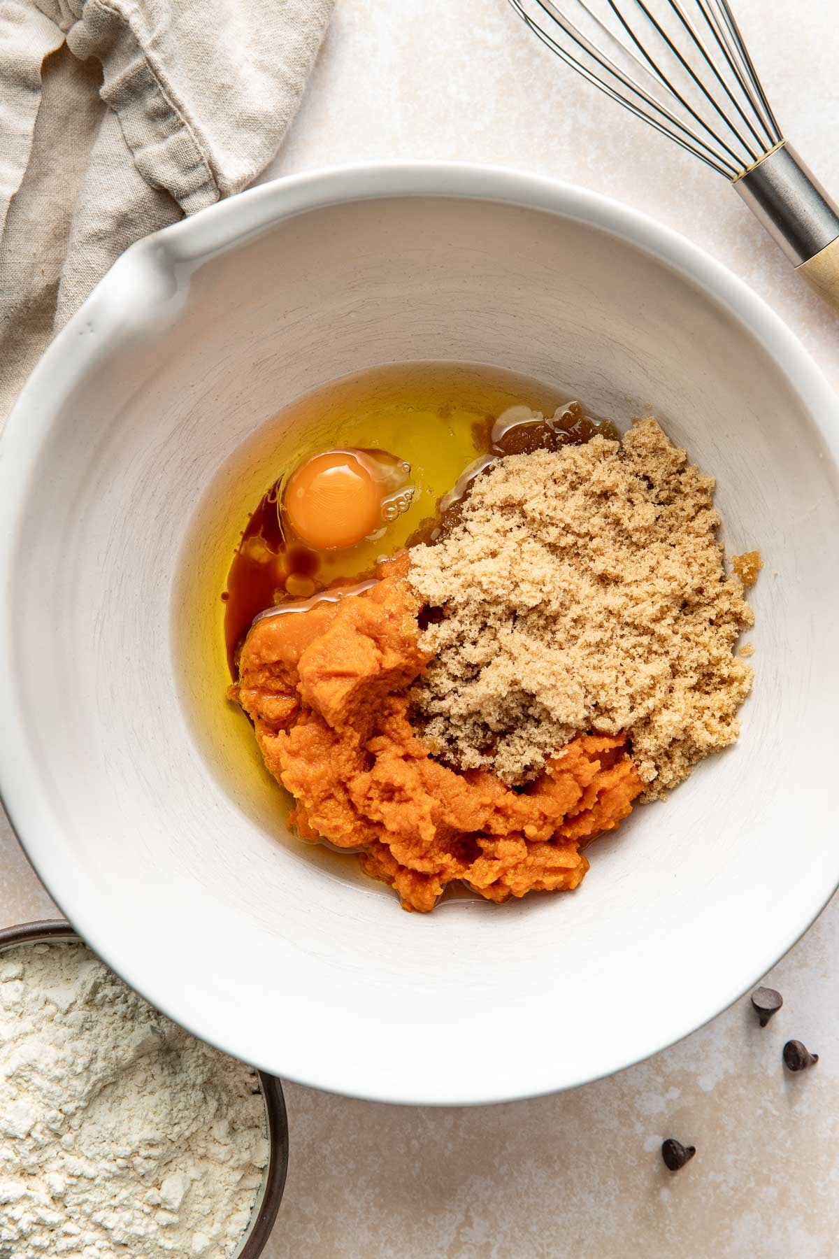 Wet ingredients to make pumpkin chocolate chip bars.