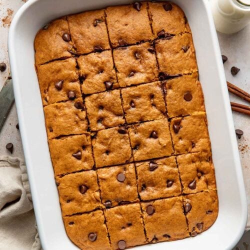 Pumpkin chocolate chip bars in a baking dish.