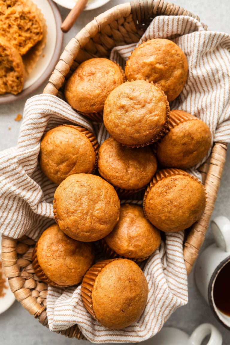 Overhead view of a basket filled with freshly baked Sweet Potato Muffins.