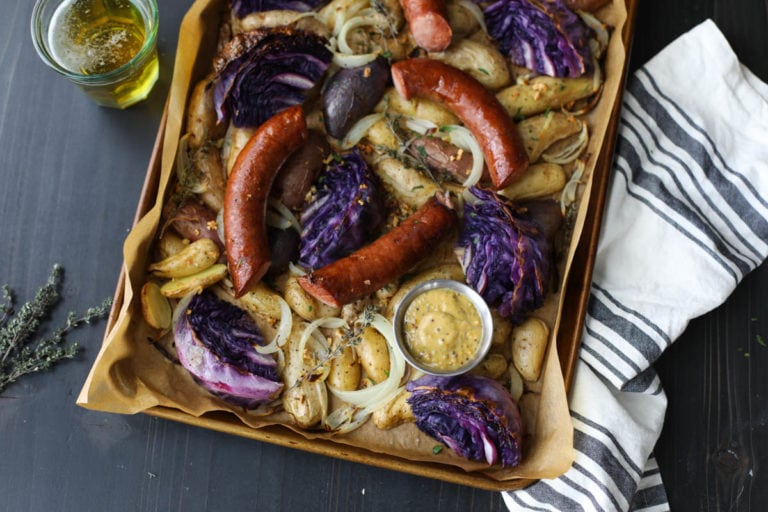 Sheet pan of kielbasa cabbage and potatoes. 