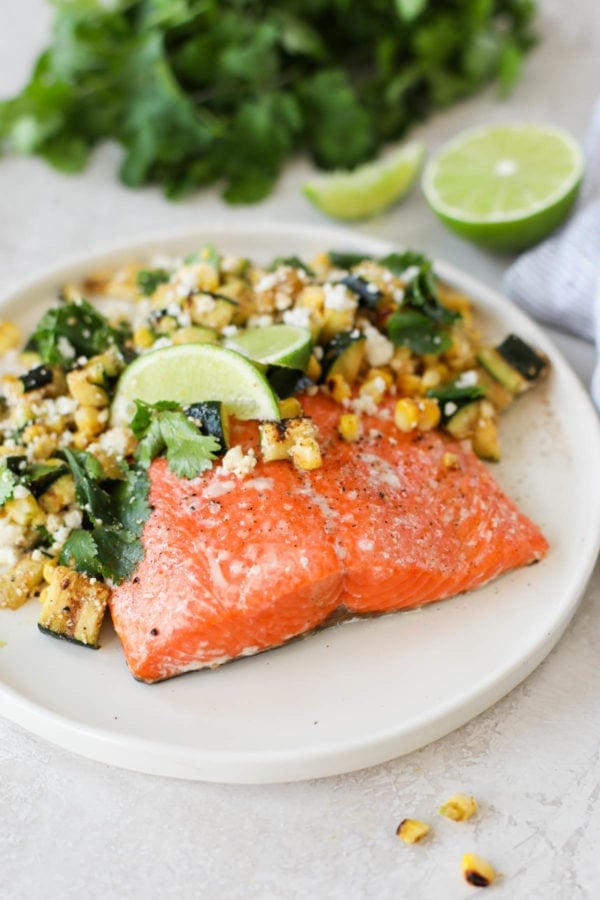 A close up view of Grilled Salmon with Elote Style Veggies that showcases the color and texture of Bristol Bay Sockeye Salmon. 