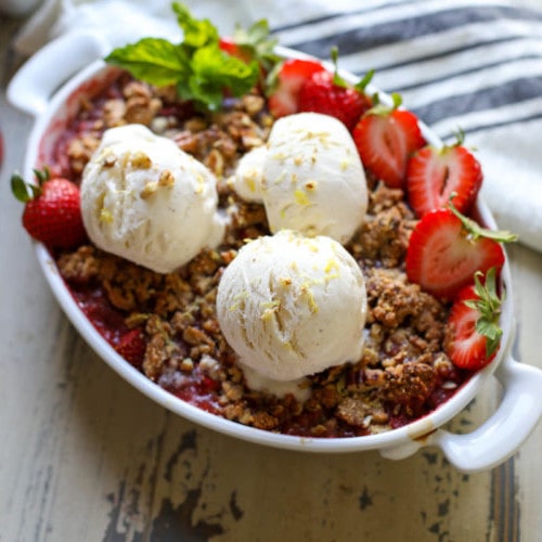 Grain Free Strawberry Rhubarb Crisp topped with vanilla ice cream