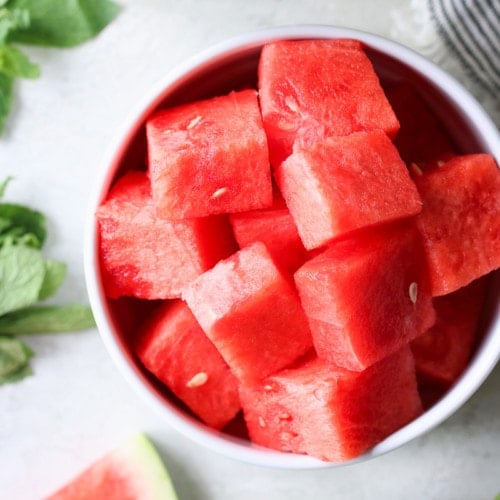Photo of a bowl of cubed watermelon for the Watermelon Mojito.