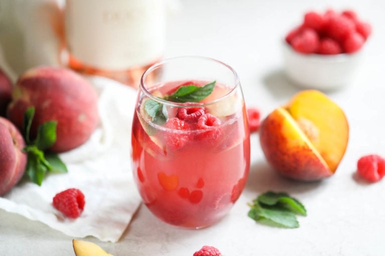 Cheers to summer! Raise a glass of our Raspberry-Peach Rosé Sangria to celebrate the sweetest things in life.