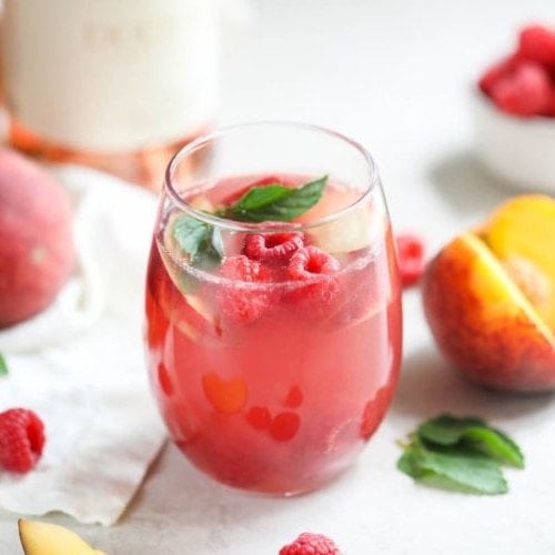 Cheers to summer! Raise a glass of our Raspberry-Peach Rosé Sangria to celebrate the sweetest things in life.