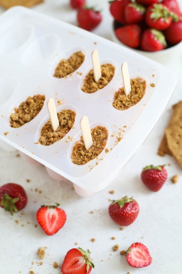 Strawberry Cheesecake Smoothie Pops Poured into Popsicle Mold