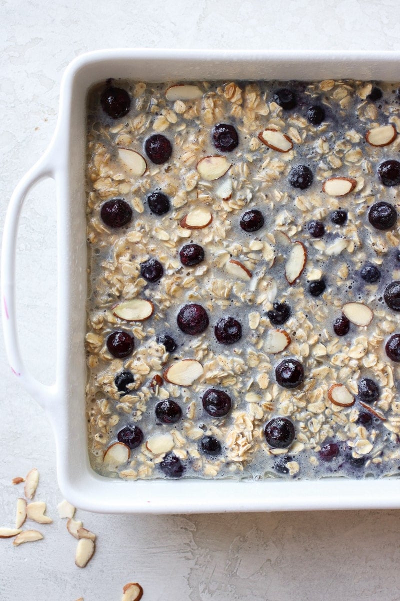 Blueberry Baked Oatmeal in a white dish before going in the oven.