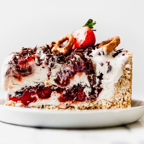 A slice of Strawberry Pretzel Ice Cream Pie plated and ready to serve.