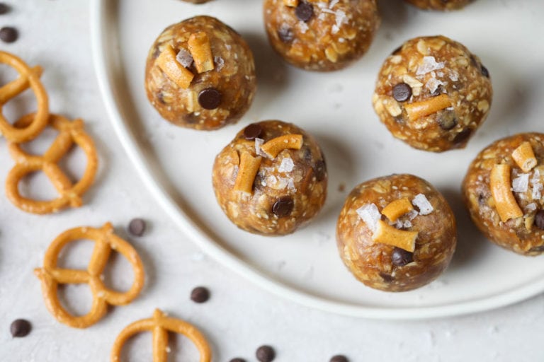 Close up overhead view sweet and salty peanut butter energy balls with crushed pretzels and mini chocolate chips. 