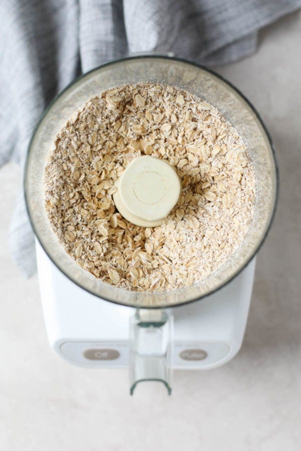 Old fashioned rolled oats in a food processor. 