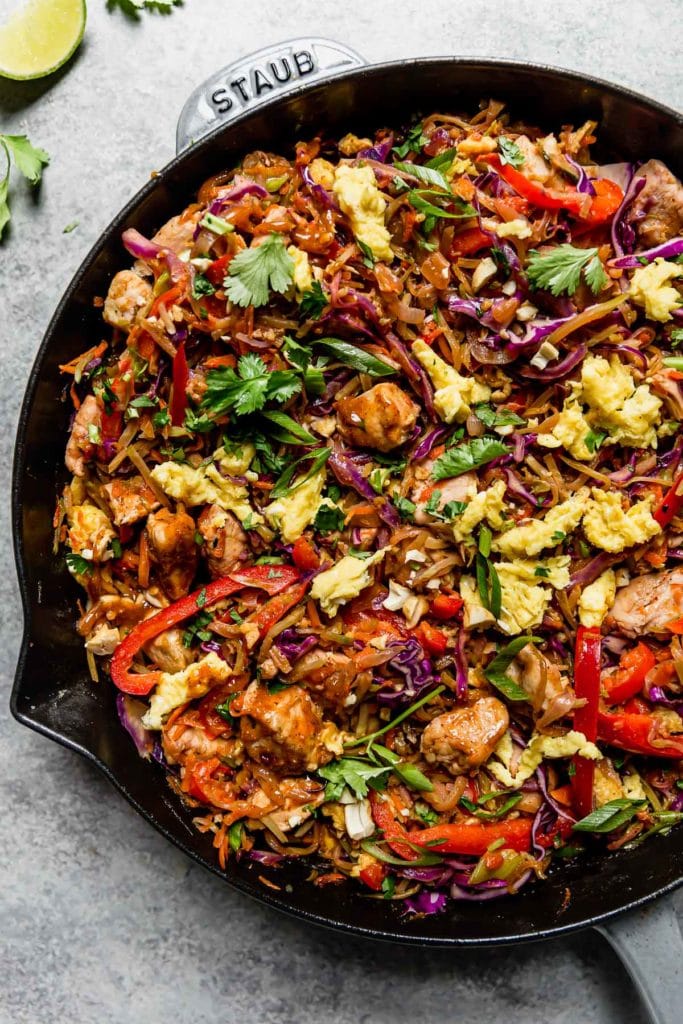 Healthy Chicken Pad Thai in a large cast iron skillet ready to serve.